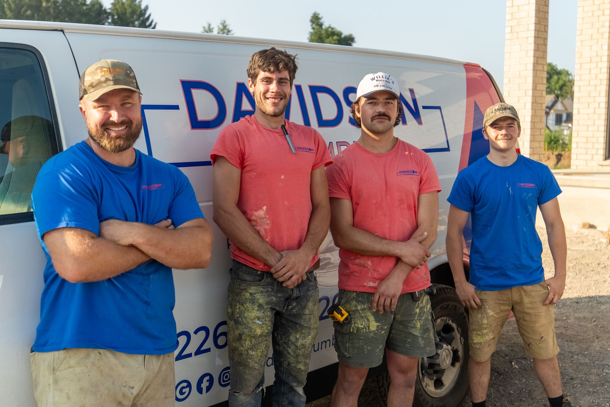 The Davidson Plumbing crew in front of their branded van, photographed by Mike Mala Media